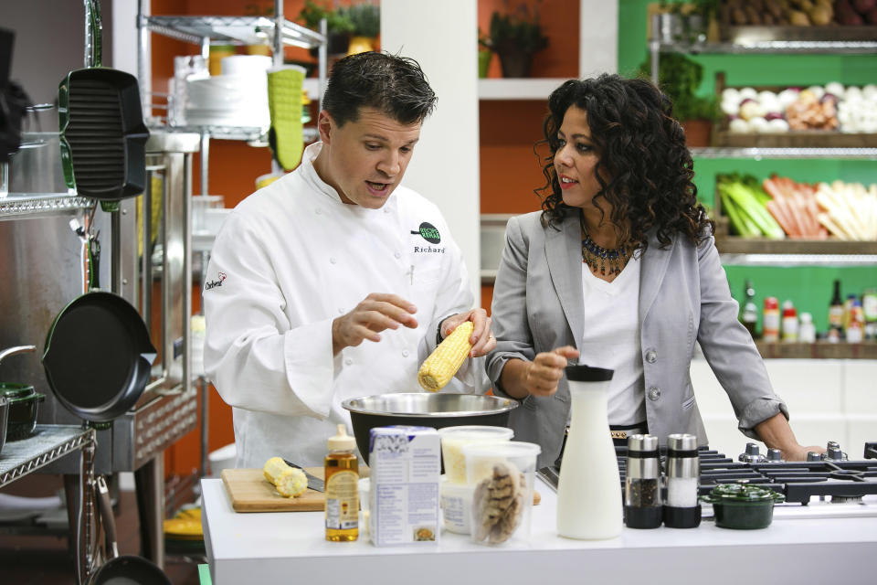 This Aug. 18, 2013 photo provided by Trium Entertainment shows Lewisburg, W. Va. resident Rich Rosendale, left, with the host of "Recipe Rehab," Evette Rios, at the studios in Calabasas, Calif. Rosendale, one of TV’s newest celebrity chefs, says his greatest challenges come on the set of "Recipe Rehab," a Saturday morning show that will begin airing Sept. 28 on CBS. (AP Photo/Trium Entertainment, Venessa Stump)