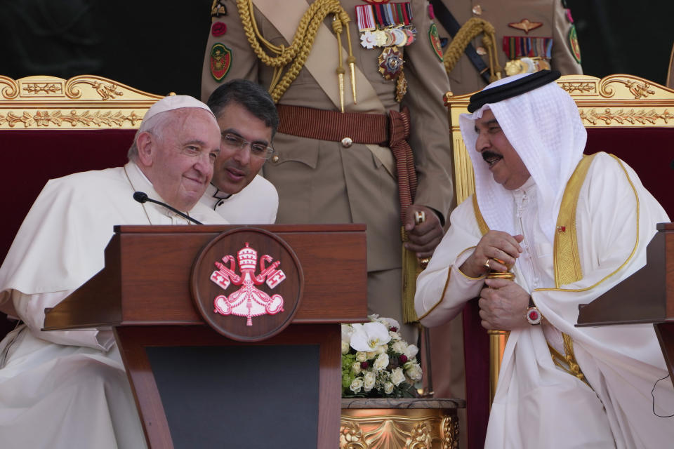 Pope Francis, left, talks with Bahrain's King Hamad bin Isa Al Khalifa, right, as they attend the closing session of the "Bahrain Forum for Dialogue: East and west for Human Coexistence," at the Al-Fida square at the Sakhir Royal palace, Bahrain, Friday, Nov. 4, 2022. Pope Francis is making the Nov. 3-6 visit to participate in a government-sponsored conference on East-West dialogue and to minister to Bahrain's tiny Catholic community, part of his effort to pursue dialogue with the Muslim world. (AP Photo/Hussein Malla)