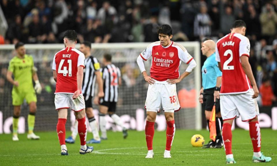 The Arsenal players Declan Rice, Takehiro Tomiyasu and William Saliba look dejected after the final whistle against Newcastle.