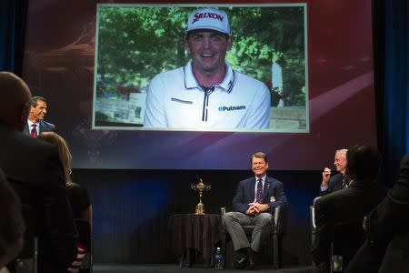 Ryder Cup team U.S. captain Tom Watson smiles as he announces that Keegan Bradley (on screen) will be one of his three picks to add to this year's Ryder Cup squad during an event in New York September 2, 2014. REUTERS/Lucas Jackson