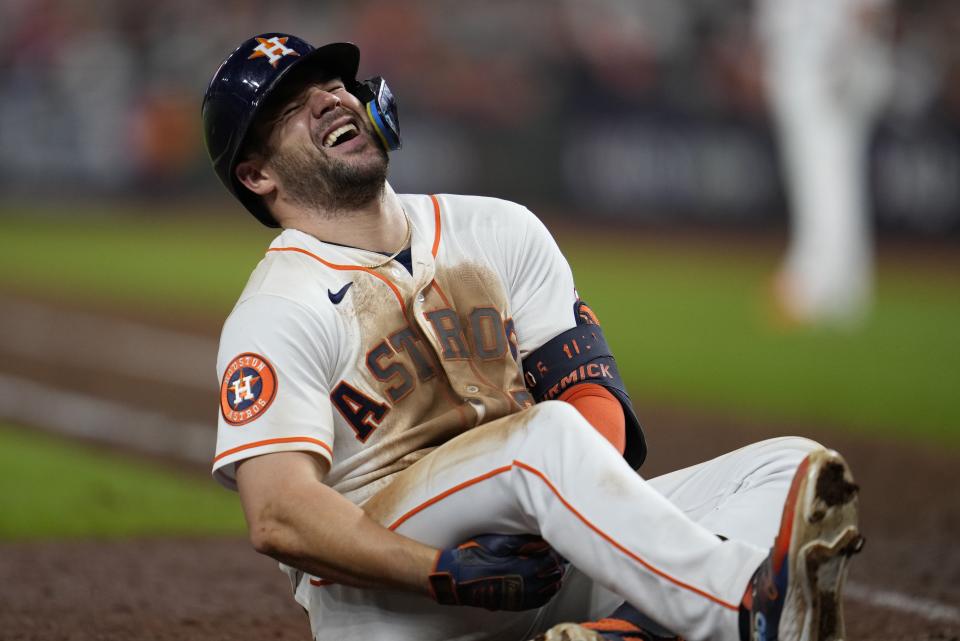 Houston Astros' Chas McCormick reacts after being hit by a pitch during the eighth inning of Game 6 of the baseball AL Championship Series against the Texas Rangers Monday, Oct. 23, 2023, in Houston. (AP Photo/Godofredo A. Vásquez)
