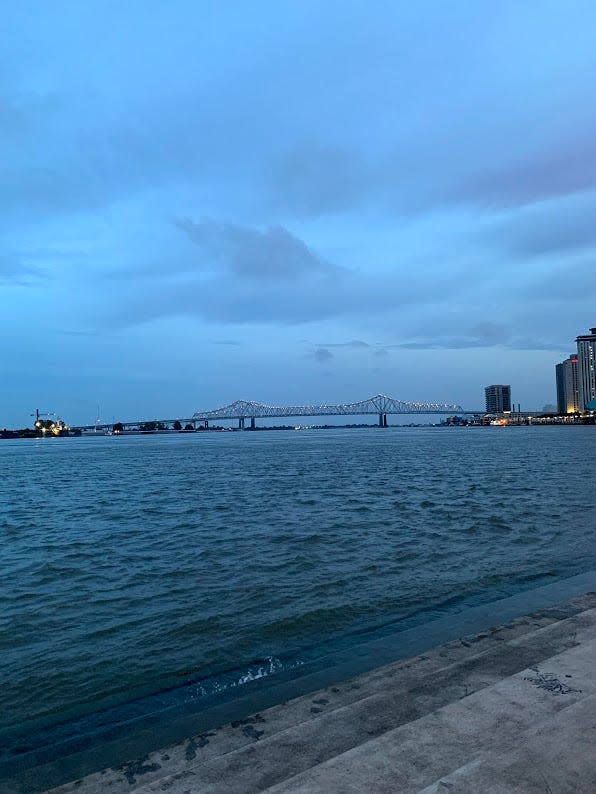 A nighttime view of the Mississippi River, across from Jackson Square in the French Quarter.