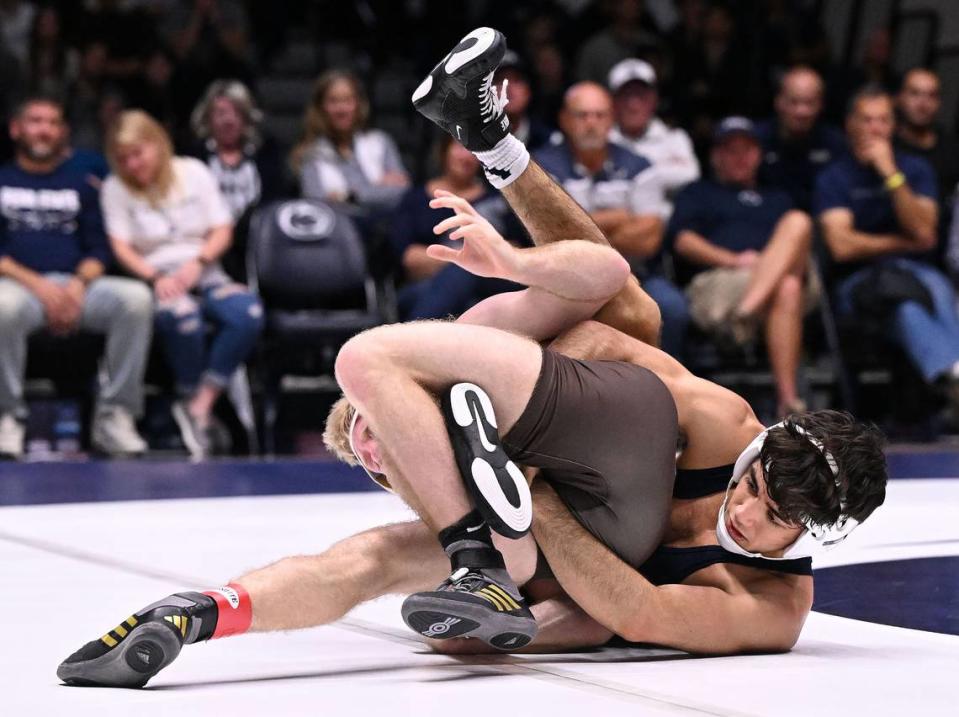 Penn State’s Aaron Nagao, right, tries to roll over Lehigh’s Ryan Crookham (133 lbs) during Sunday’s match at Rec Hall at Penn State. Crookham defeated Nagao, 6-3. Penn State defeated Lehigh, 30-10.