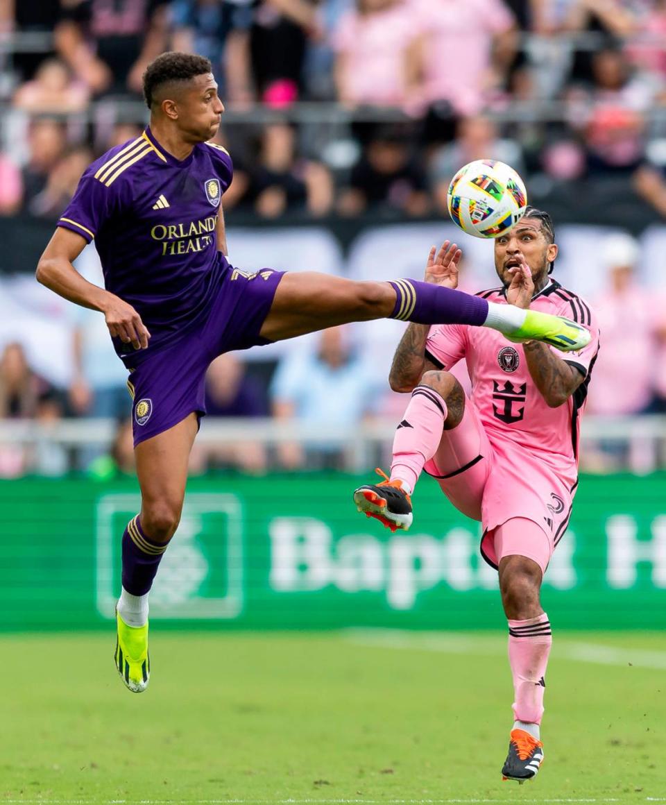 Orlando City defender Rafael Santos (3) and Inter Miami defender DeAndre Yedlin (2) compete for the ball in the first half of their MLS match at Chase Stadium on Saturday, March 2, 2024, in Fort Lauderdale, Fla.