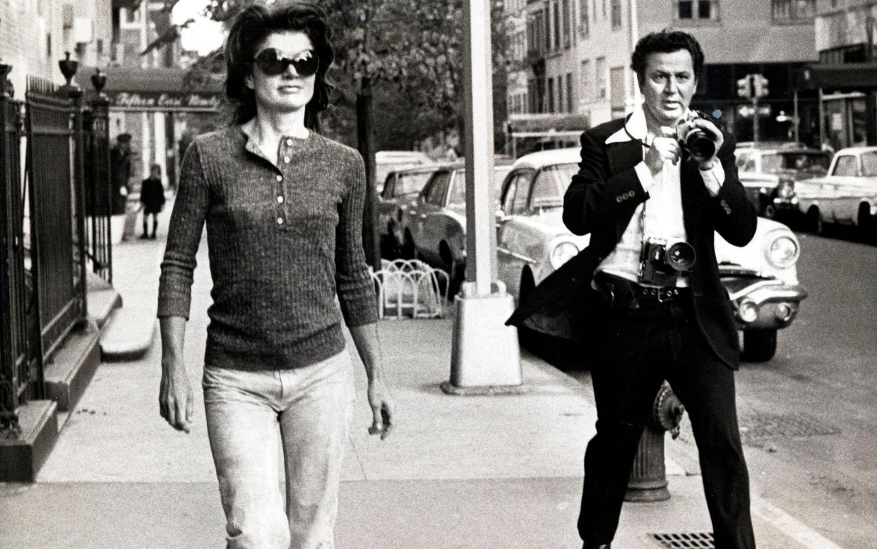 Ron Galella trailing Jackie Kennedy: eventually she took him to court and he was ordered to keep at least 25ft away - Magnolia Pictures/Avalon