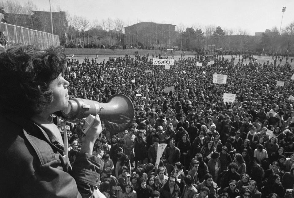 File - Iranian women demonstrate for equal rights, March 12, 1979. Iran's Islamic Republic requires women to cover up in public. But many Iranian women have long played a game of cat-and-mouse with authorities as a younger generation wears their veils more loosely or skirts requirements for conservative dress. (AP Photo/Richard Tomkins, File)