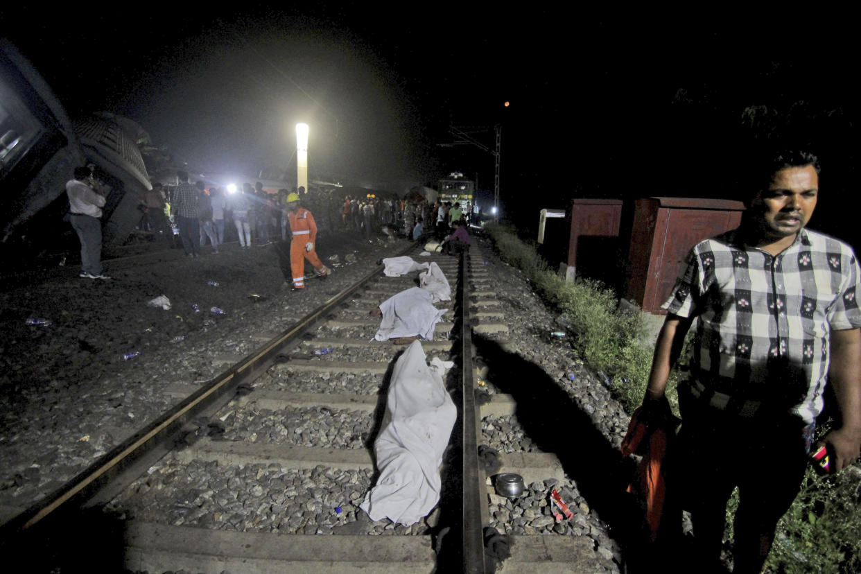 Bodies recovered from passenger trains lay on the track at the site of an accident, in Balasore district, in the eastern Indian state of Orissa, Saturday, June 3, 2023. Two passenger trains derailed in India, killing more than 200 people and trapping hundreds of others inside more than a dozen damaged rail cars, officials said. (AP Photo)