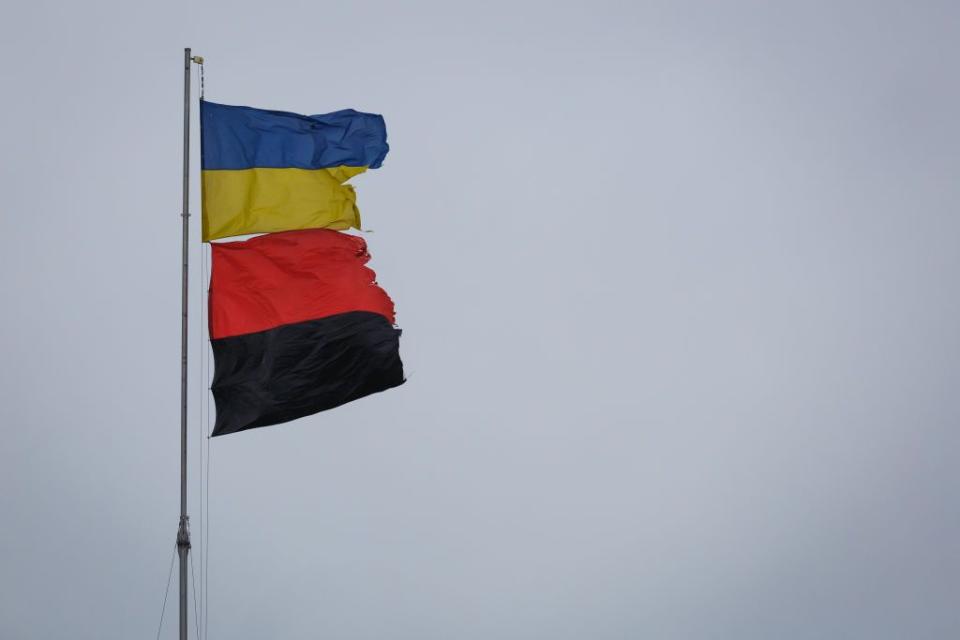 The state blue and yellow flag and the red and black flag fly at a military cemetery in Dnipro on Jan. 18, 2023 in Dnipro, Ukraine. (Photo by Yurii Stefanyak/Global Images Ukraine via Getty Images)