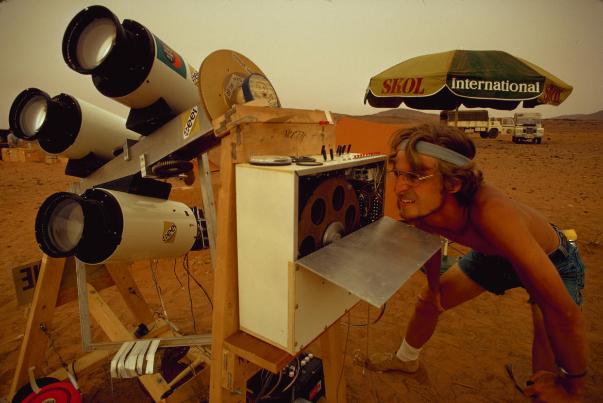 1973: An astronomer with Educational Expeditions International in Mauritania's desert uses astronomical equipment to view a total solar eclipse. 