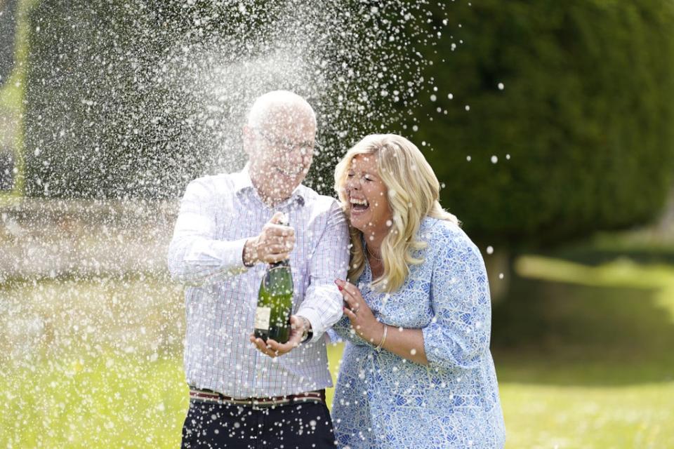 Joe Thwaite, 49, and Jess Thwaite, 46, from Gloucestershire celebrate after winning the record-breaking EuroMillions jackpot of £184M from the draw on Tuesday 10 May, 2022 (PA)