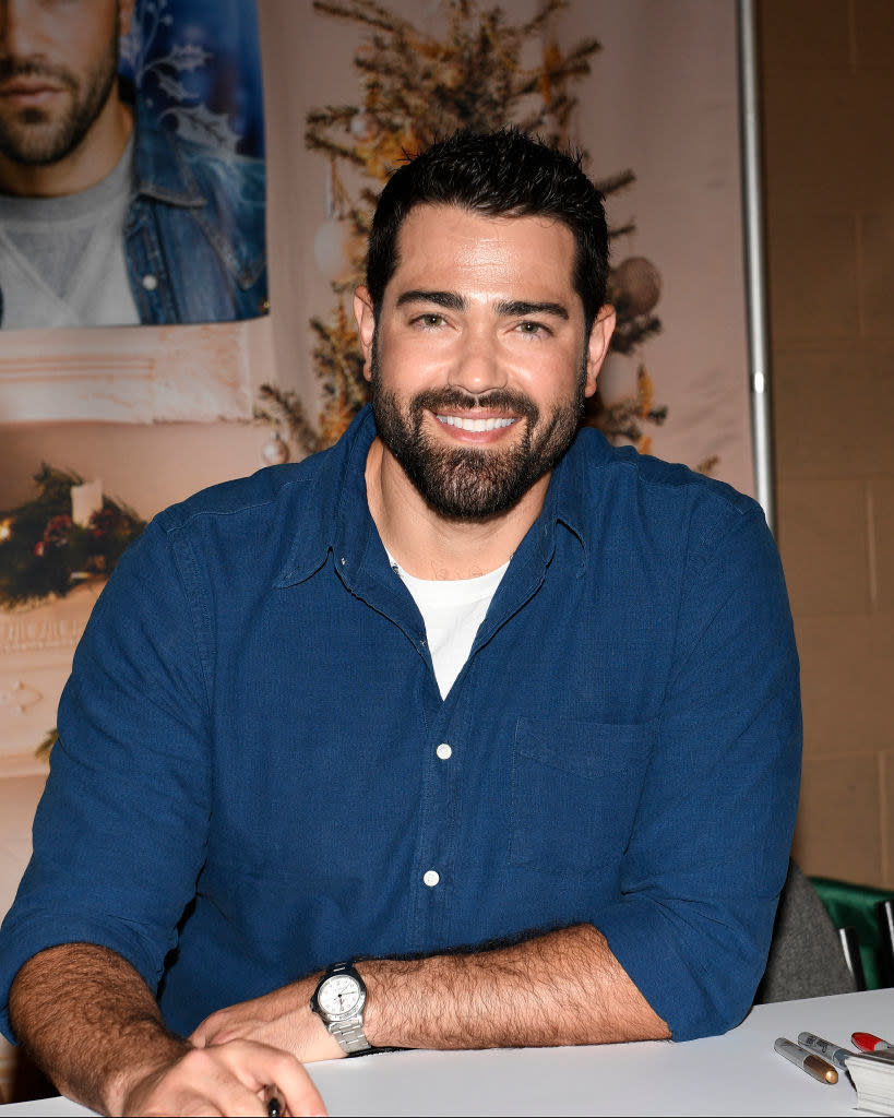 Jesse sitting at a table and smiling