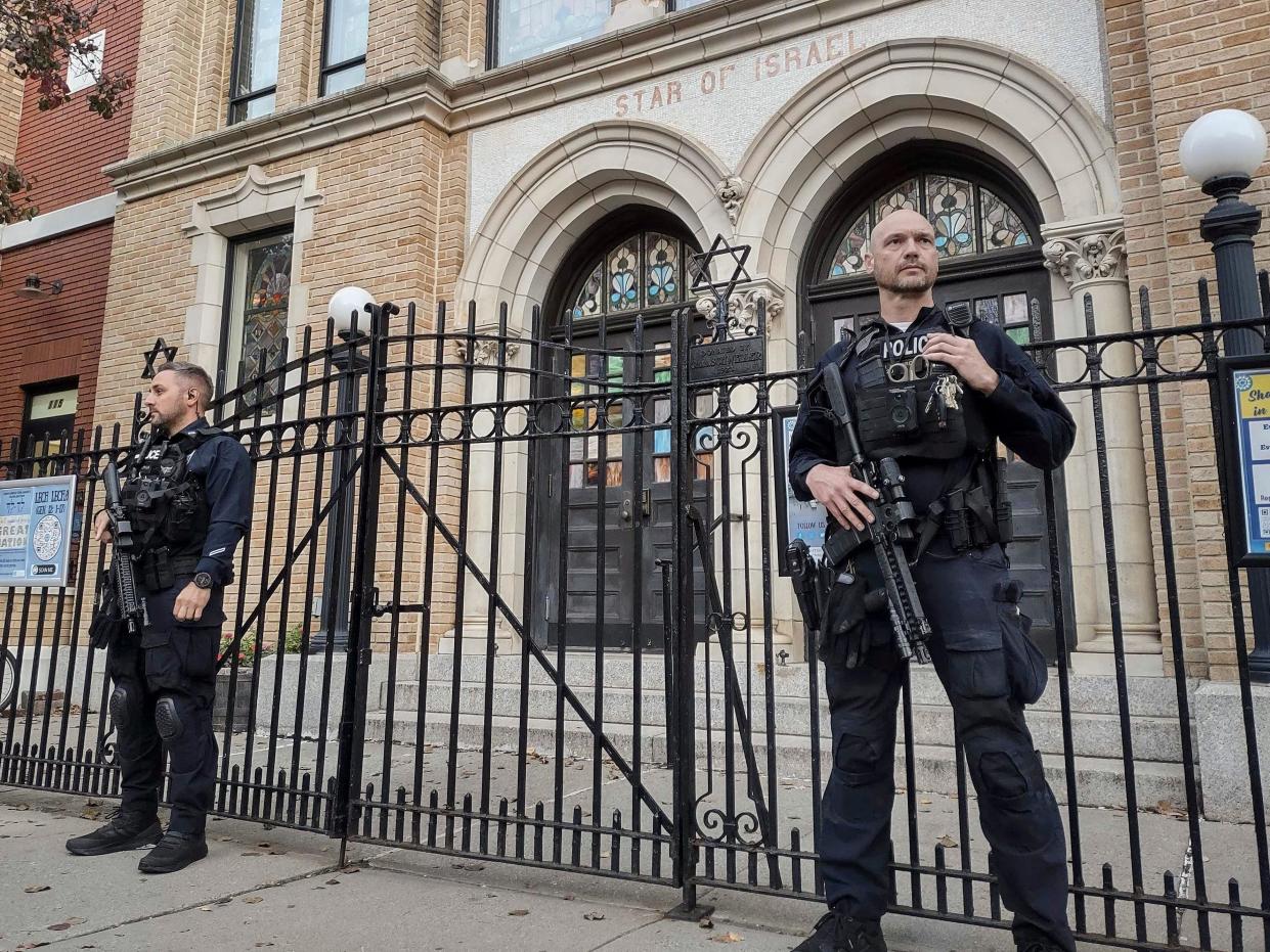 Hoboken Police officers stand watch outside the United Synagogue of Hoboken, Thursday, Nov. 3, 2022, in Hoboken, N.J.
