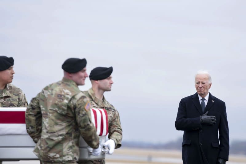 President Joe Biden watches as a U.S. Army carry team carries the transfer case containing the body of Army Sgt. Kennedy Sanders during a dignified transfer at Dover Air Force Base in Dover, Del., on Friday. Photo by Bonnie Cash/UPI