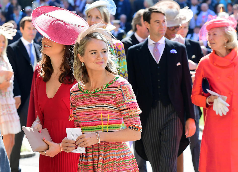 Cressida Bonas wears a bright striped dress with the small feathered fascinator. (Photo: IAN WEST via Getty Images)