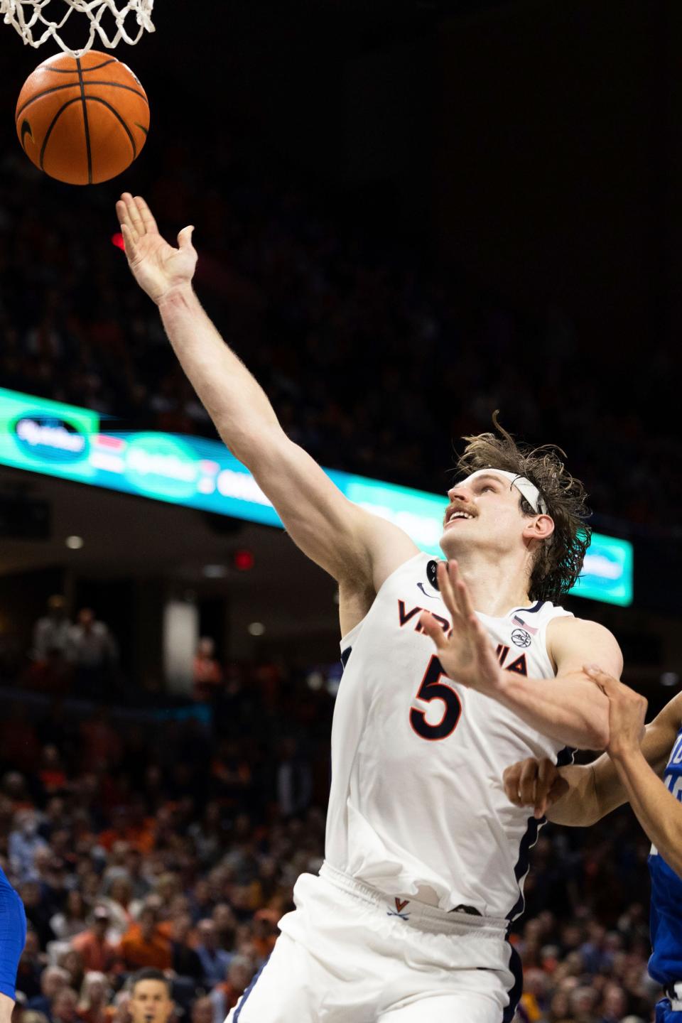 Virginia's Ben Vander Plas (5) fights for a basket against Duke during overtime of an NCAA college basketball game in Charlottesville, Va., Saturday, Feb. 11, 2023. (AP Photo/Mike Kropf)