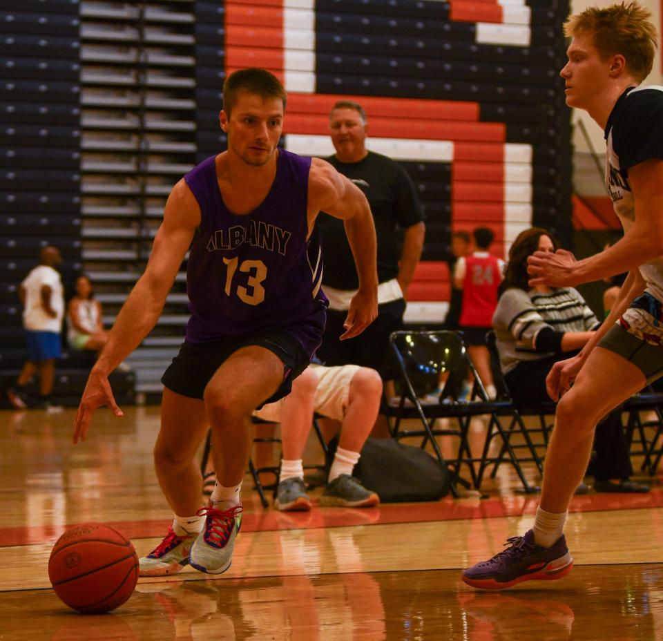 Albany's Jack Rieland dribbles Tuesday in the St. Cloud Breakout tournament at St. Cloud Tech High School