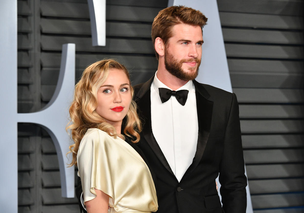 Miley Cyrus and Liam Hemsworth attend the 2018 Vanity Fair Oscar Party on March 4, 2018, in Beverly Hills, Calif. (Photo: Getty Images)