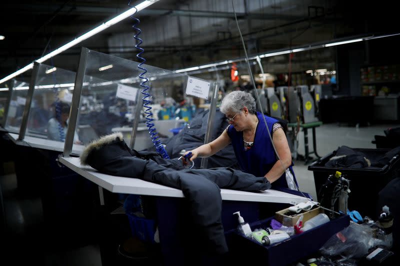 FILE PHOTO: Workers make jackets at the Canada Goose factory in Toronto