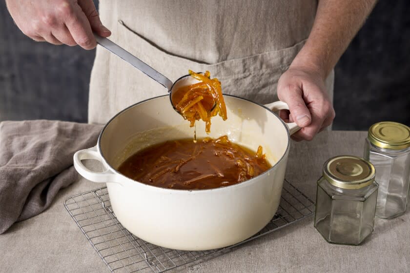 LOS ANGELES, CALIFORNIA, Jan. 19, 2022: Step-by-step citrus marmalade-cooking guide: checking the texture of cooked Seville-oranges marmalade for the January "LA in A Jar" story by Ben Mims, photographed on Wednesday, January 18, 2022, at Proplink Studios in the Arts District in Downtown Los Angeles. (Silvia Razgova / For The Times, Prop Styling / Jennifer Sacks, Photo Assistant / Olliver Leighton)