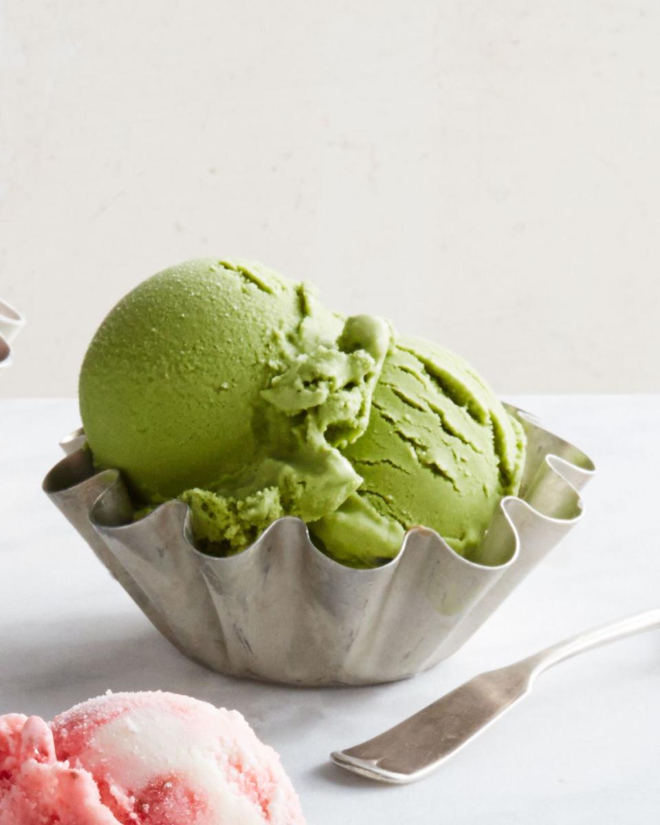 green tea honey frozen yogurt in a small bowl with a spoon