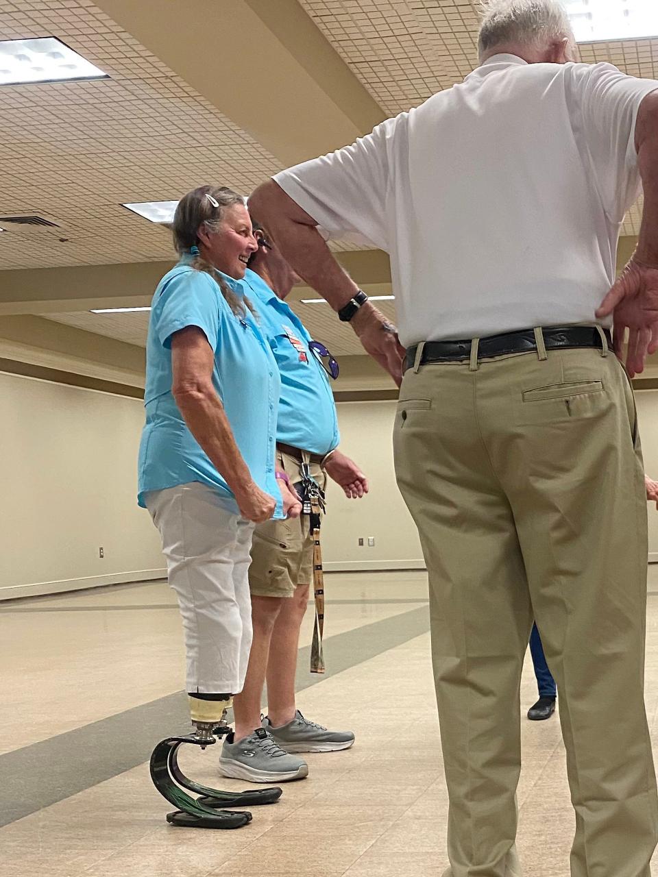 Priscilla Newton, on her prosthetic blades, takes part in a recent square dancing event at Gadsden's Downtown Civic Center.