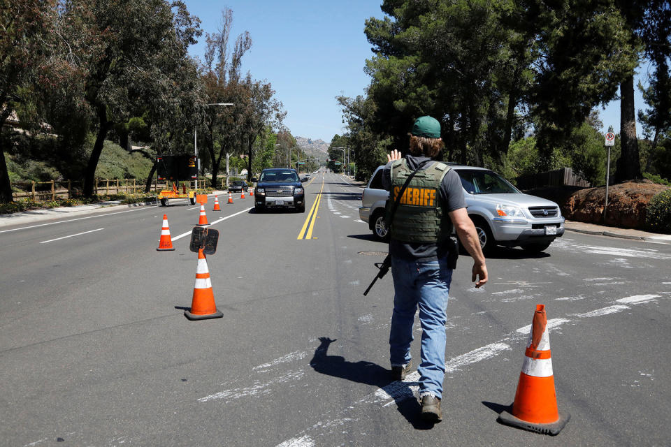 A San Diego County Sheriffís Deputy secures the scene of a shooting incident at the Congregation Chabad synagogue in Poway, north of San Diego, April 27, 2019. (Photo: John Gastaldo/Reuters)