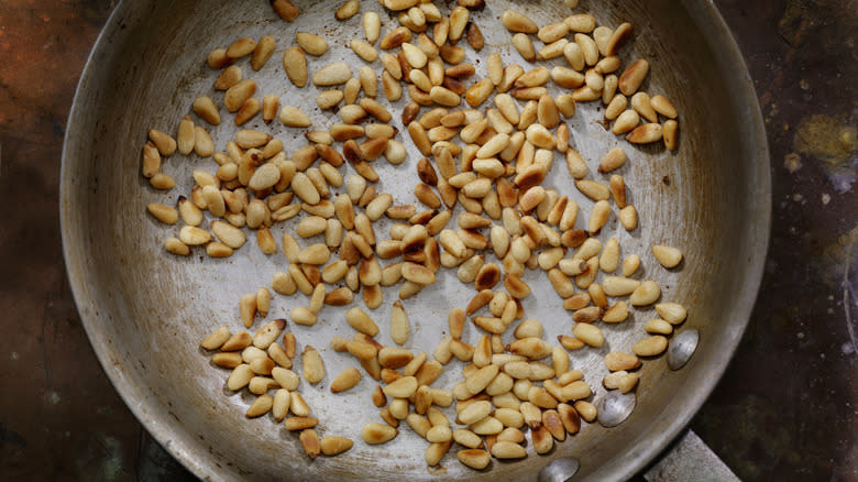 pine nuts toasting in pan