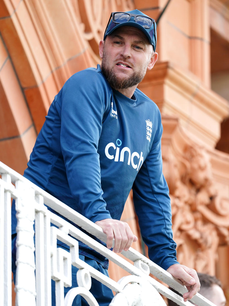 Brendon McCullum looks on from the balcony.