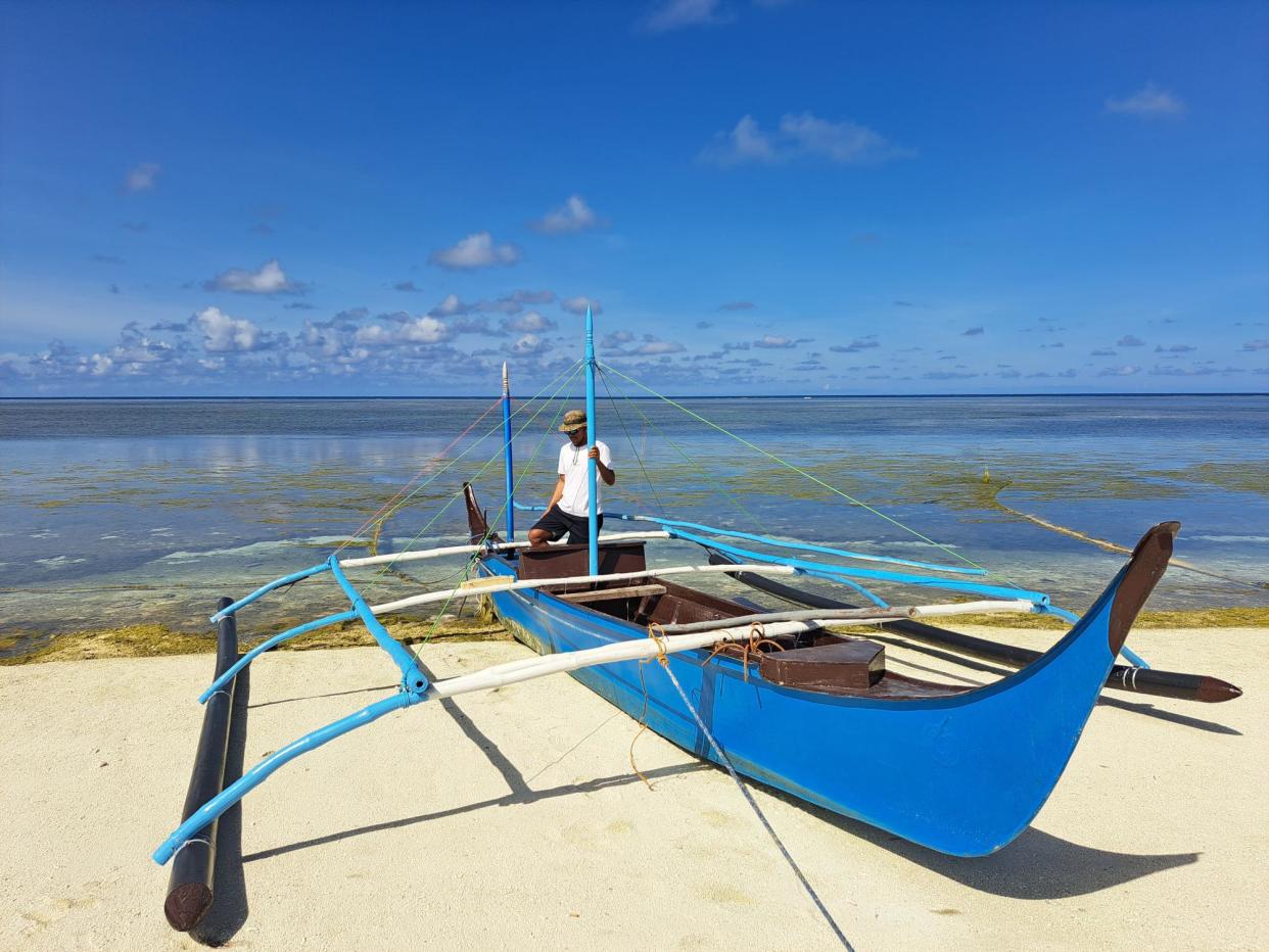 <span>Rolly Dela Cruz often encounters Chinese vessels while fishing in the South China Sea waters surrounding Thitu Island.</span><span>Photograph: Rebecca Ratcliffe/The Guardian</span>