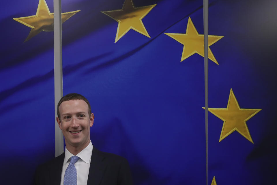 Facebook CEO Mark Zuckerberg smiles as he shakes hands with European Commissioner for Values and Transparency Vera Jourova prior to a meeting at EU headquarters in Brussels, Monday, Feb. 17, 2020. (AP Photo/Francisco Seco)