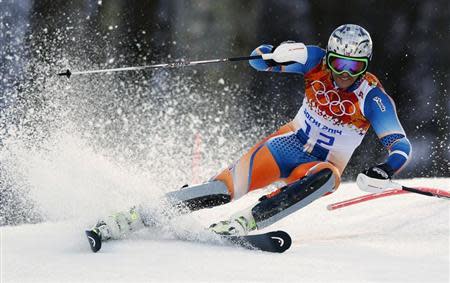 Norway's Aksel Lund Svindal competes in the slalom run of the men's alpine skiing super combined event at the 2014 Sochi Winter Olympics at the Rosa Khutor Alpine Center February 14, 2014. REUTERS/Dominic Ebenbichler