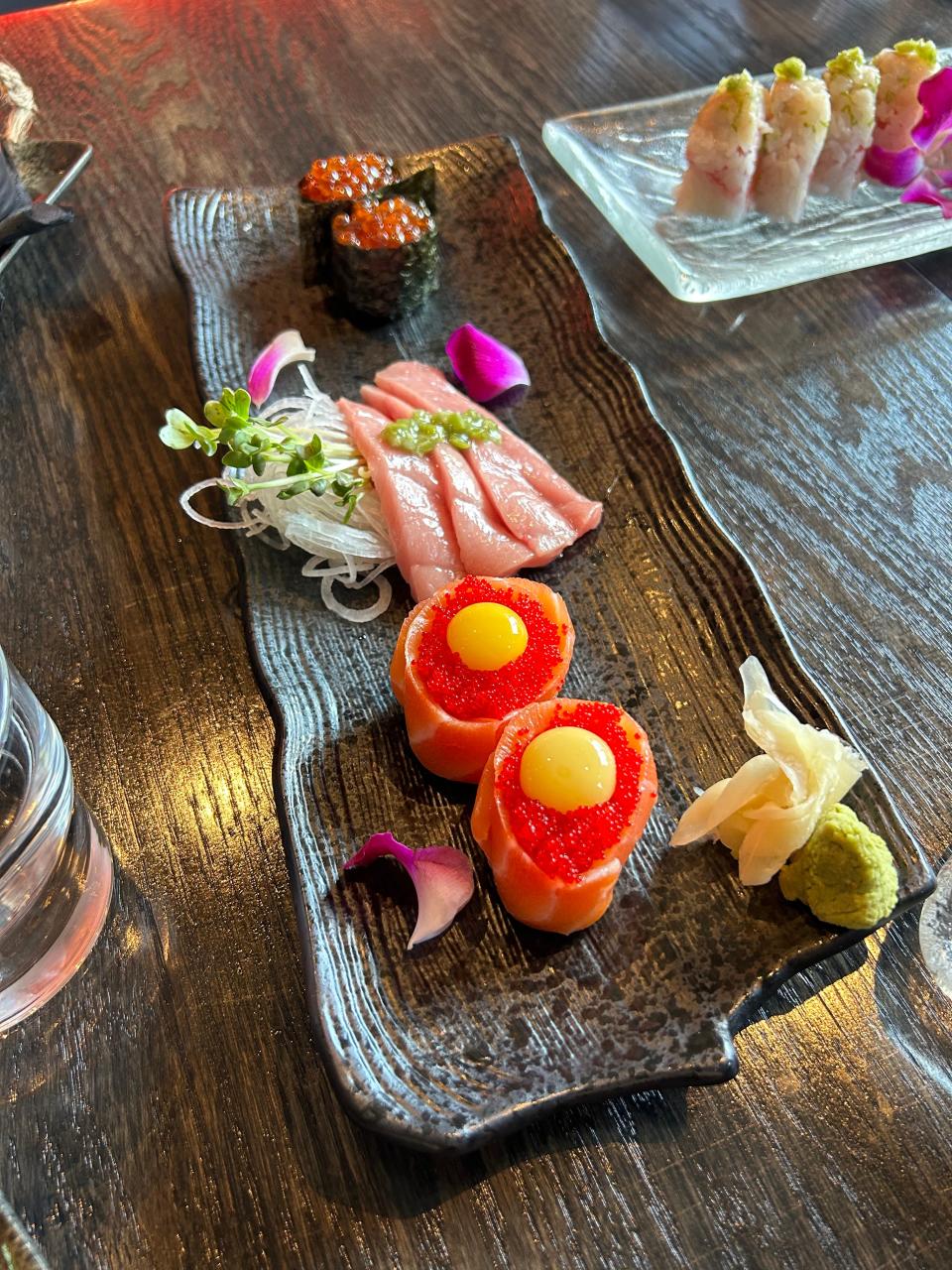 From top to bottom, ikura nigiri, toro sashimi and the sake sunrise at Ichigo Ichie.