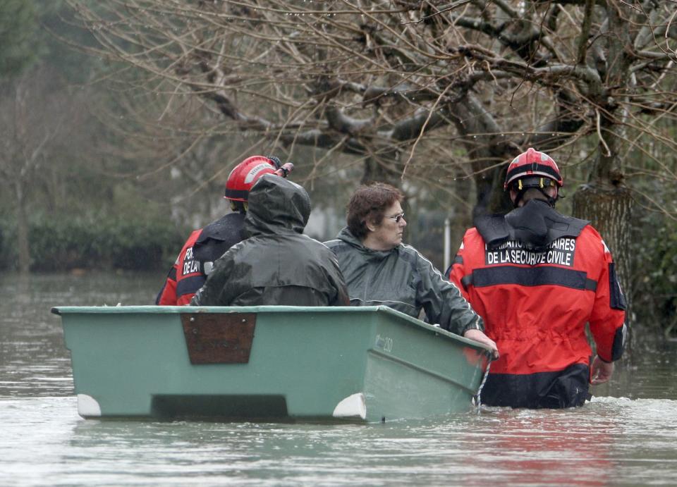 Residents of La Faute sur Mer are evacuated by firefighters as a result of a storm, Monday, March 1, 2010.