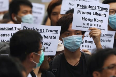 Hong Kong activists march to major international consulates in an attempt to rally foreign governments' support for their fight against a controversial extradition bill, in Hong Kong