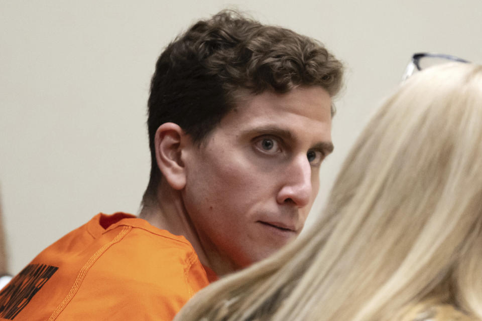 FILE - Bryan Kohberger, left, who is accused of killing four University of Idaho students in November 2022, looks toward his attorney, public defender Anne Taylor, right, during a hearing in Latah County District Court, Jan. 5, 2023, in Moscow, Idaho. Investigators seized stained bedding, strands of what looked like hair and a single glove — but no weapon — when they searched the Washington state apartment of Kohberger, a graduate student, charged with stabbing four University of Idaho students to death, according to court documents newly unsealed on Tuesday, Jan. 17, 2023. (AP Photo/Ted S. Warren, Pool)