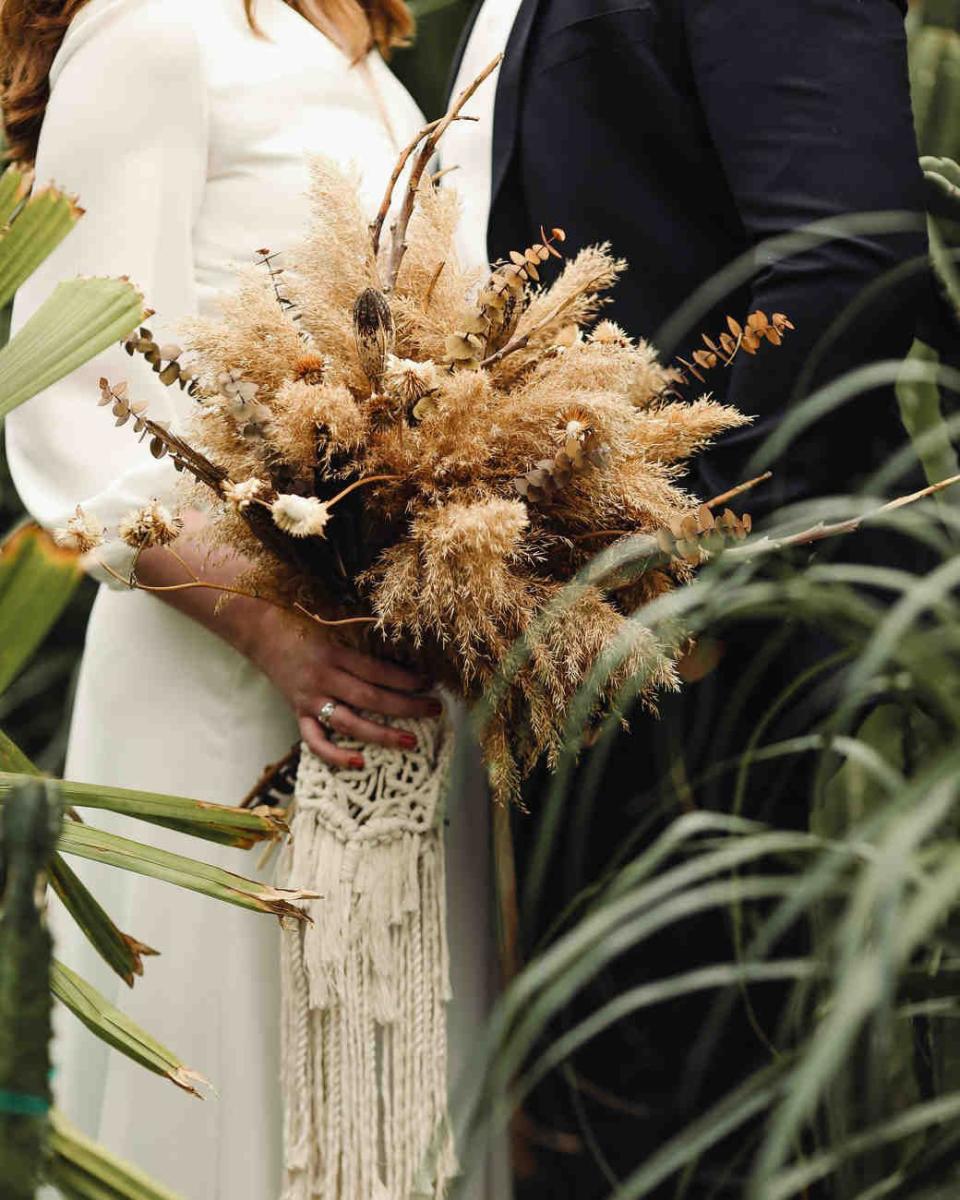 <p>We get it, boho was big–but now, scale it back to small details. A knotted lace used in unconventional ways offers an elegant dose of bohemian style to any modern look. Textural elements and fringe make for a spirited bouquet, especially when paired with a minimal bridal gown and tawny-toned florals. Just be cautious to use this crafty folklore facet sparingly-with something this crafty in feel, a little bit goes a long way. </p>