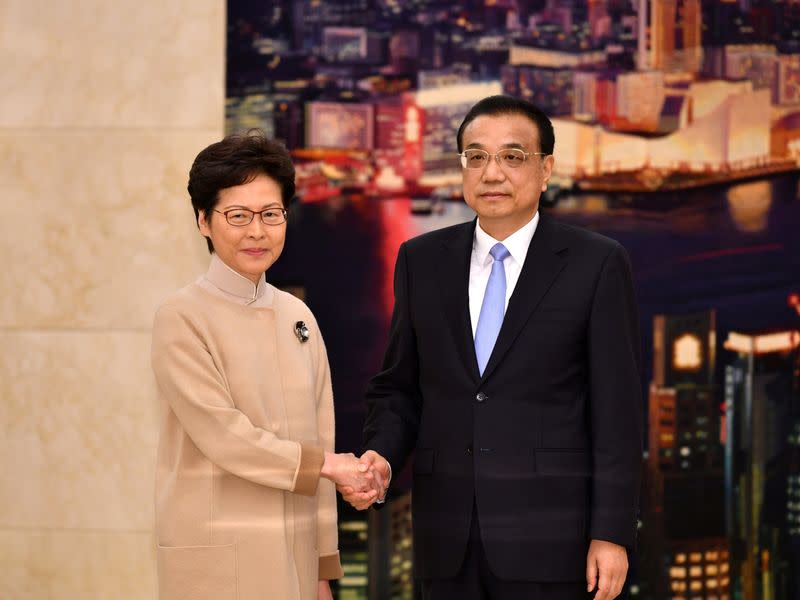 Hong Kong Chief Executive Carrie Lam shakes hands with Chinese Premier Li Keqiang during their meeting in Beijing