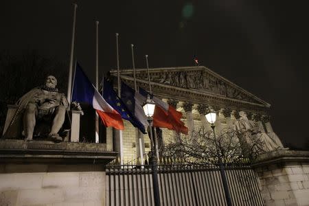 French and European flags fly at half-mast outside the National Assembly in Paris January 7, 2015, following a shooting by gunmen at the offices of weekly satirical magazine Charlie Hebdo. REUTERS/Jacky Naegelen