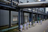 Workers are seen at a Dongfeng Honda factory in Wuhan