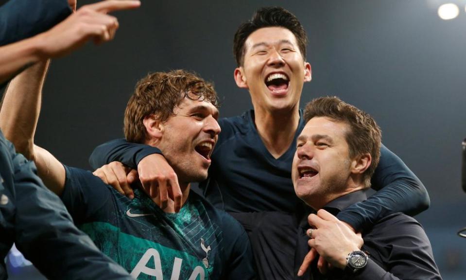 Fernando Llorente and Son Heung-min celebrate victory with Mauricio Pochettino at the final whistle.