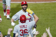 St. Louis Cardinals' Albert Pujols, top, celebrates with Juan Yepez as he heads to the dugout after he hit home run No. 703 in his career during the fifth inning of a baseball game against the Pittsburgh Pirates, Monday, Oct. 3, 2022, in Pittsburgh. (AP Photo/Keith Srakocic)