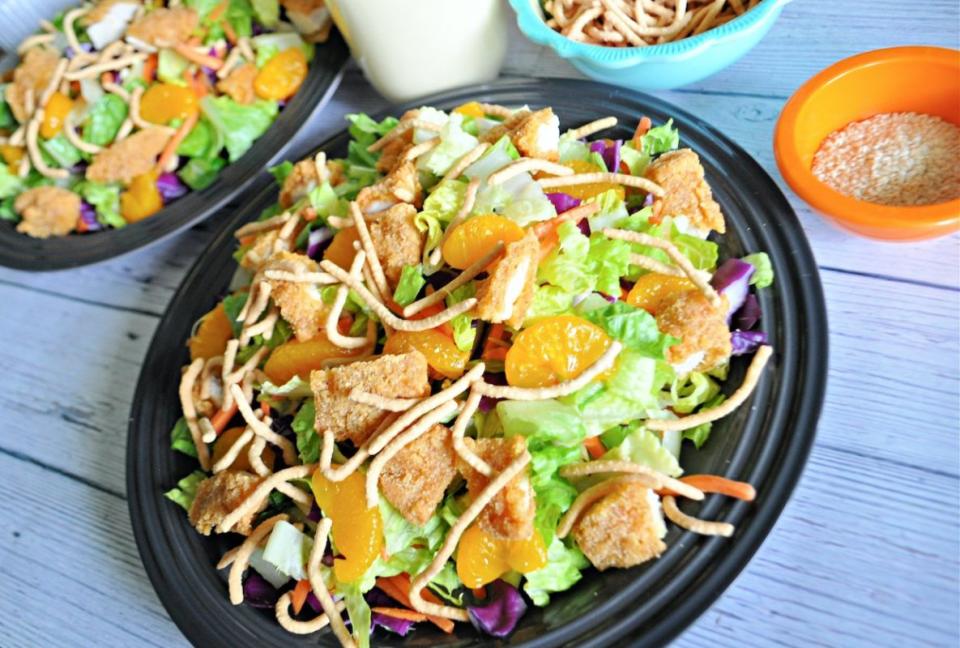 <p>Krista Marshall</p><p>In this Oriental chicken salad, the mix of salty, crispy chicken, crunchy noodles and almonds, sweet orange slices and a tangy Oriental vinaigrette can’t be beaten—any time of year.</p><p><strong>Get the recipe: <a href="/1241042/kristamarshall/copycat-applebees-oriental-chicken-salad/" data-ylk="slk:Copycat Applebee's Oriental Chicken Salad;elm:context_link;itc:0;sec:content-canvas" class="link ">Copycat Applebee's Oriental Chicken Salad</a></strong></p>