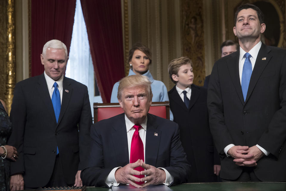 <p>President Donald Trump is joined by the Congressional leadership and his family before formally signing his cabinet nominations into law, Friday, Jan. 20, 2107, in the President’s Room of the Senate on Capitol Hill in Washington. From left are, Vice President Mike Pence, the president’s wife Melania Trump, their son Barron Trump, and House Speaker Paul Ryan of Wis. (Photo: J. Scott Applewhite, Pool/AP) </p>