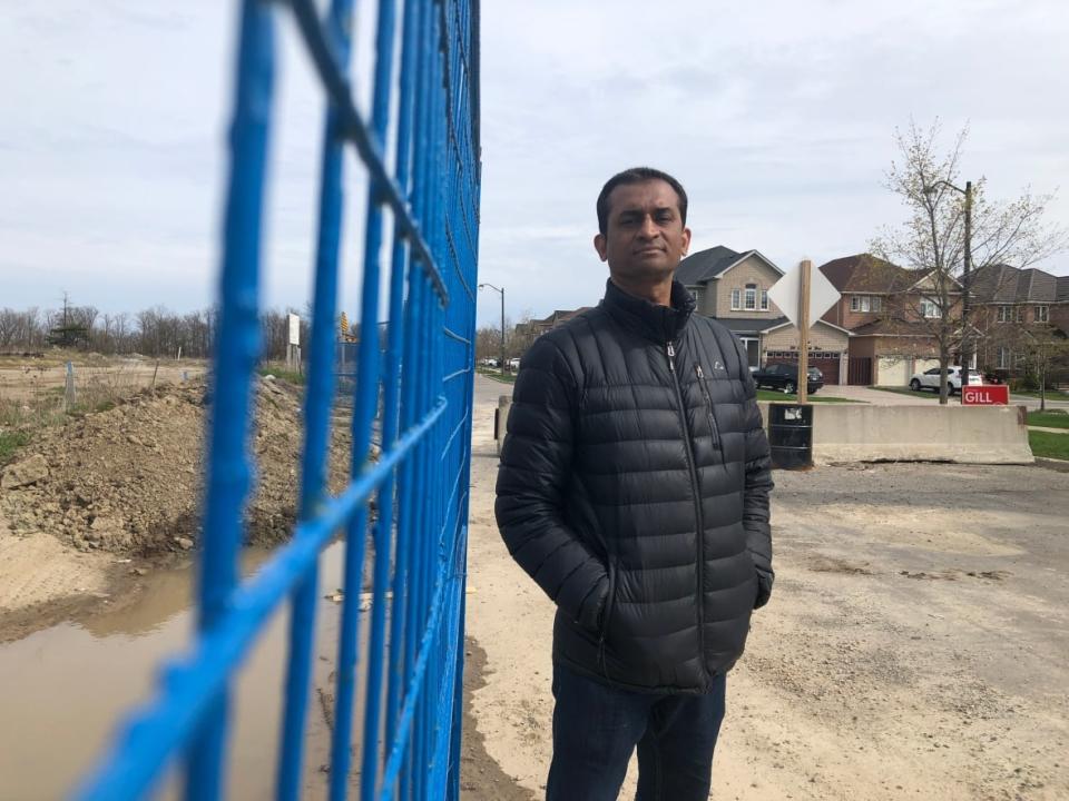 Jawed Yusuf put a deposit down on a home with an in-law suite so he could bring his father from Pakistan to live with his family. He's disappointed his plan will not come to fruition.  (Angelina King/CBC - image credit)
