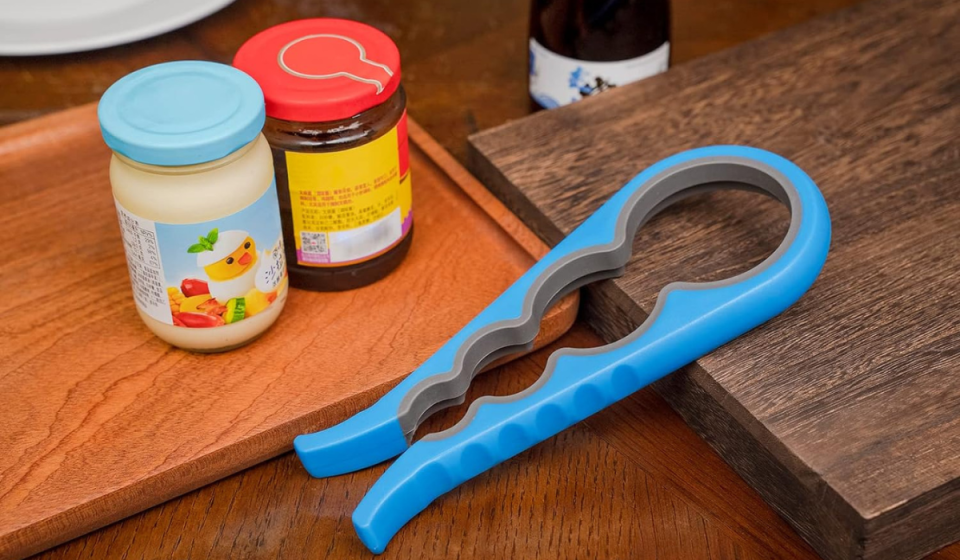 the blue jar opener next to some condiment jars