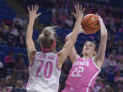 Iowa's Caitlin Clark (22) pulls up to shoot on Penn State's Makenna Marisa (20) during the second half of an NCAA college basketball game, Sunday, Feb. 5, 2023, in State College, Pa. (AP Photo/Gary M. Baranec)