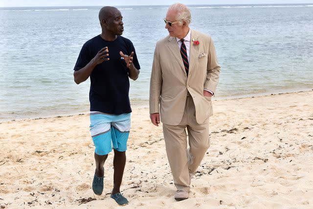 <p>Pool/Samir Hussein/WireImage</p> King Charles chats with coral restoration team officer Katana Ngala Hinzano at Kuruwitu Marine Conservation Reserve on November 2.