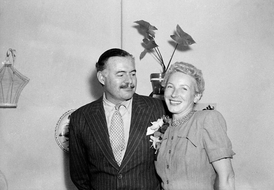 FILE - This March 14, 1946 file photo shows author Ernest Hemingway with his new wife, Mary Welsh, after their wedding in Havana, Cuba. Hemingway and John F. Kennedy never met, but the author's most extensive personal collection is housed at JFK's presidential library and is now on public display. The exhibition opening Monday, April 11, 2016, in Boston includes original manuscripts of some of his most famous literary works; letters to other major literary figures of his time; photographs and other personal mementos. (AP Photo, File)