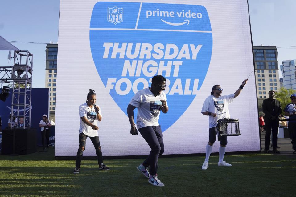 Robert "Bojo" Ackah, center, and Fik-Shun, left, performed for the announcement of the first Thursday night NFL game on Prime Video.