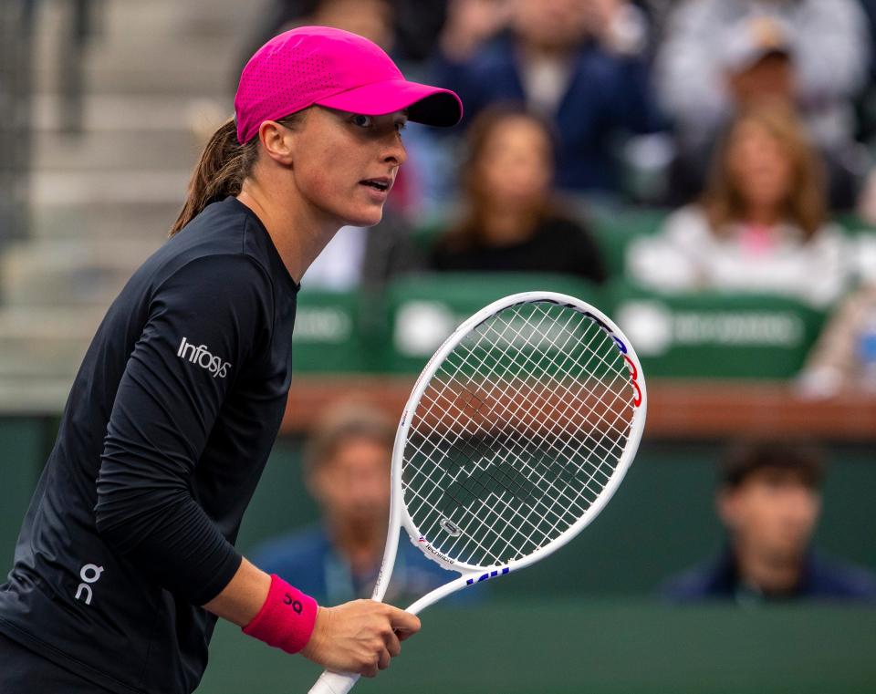 Iga Swiatek reacts to a point won over Marta Kostyuk during the WTA semifinals of the BNP Paribas Open in Indian Wells, Calif., Friday, March 15, 2024.